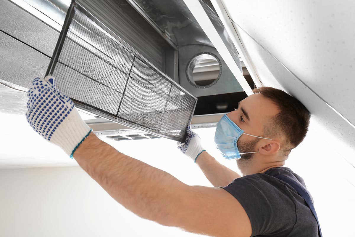 Man performing diy duct cleaning